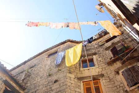 Picturesque Mediterranean street and traditional architectural details in Trogir, Croatia.の写真素材