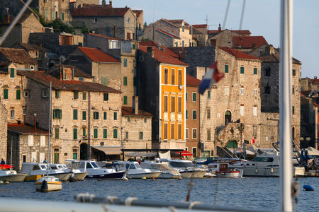 Historical buildings and boats on the coast of Sibenik, Croatia.の写真素材