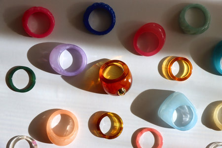 Collection of colorful plastic rings on white background. Top view.の写真素材