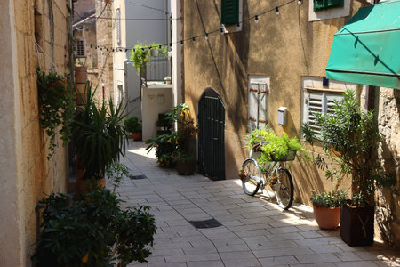 Picturesque Mediterranean street in coastal town Makarska, Croatia. Makarska is popular summer travel destination.の写真素材