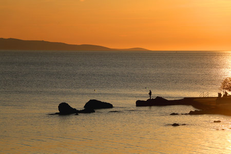 Beautiful sunset on the Bacvice beach in Split, Croatia.の写真素材
