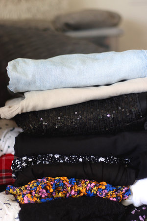 Folded clothes during closet cleanout.の写真素材