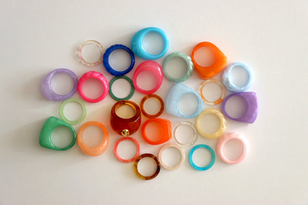 Collection of colorful plastic rings on white background. Top view.の写真素材