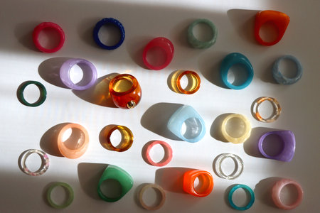 Collection of colorful plastic rings on white background. Top view.の写真素材