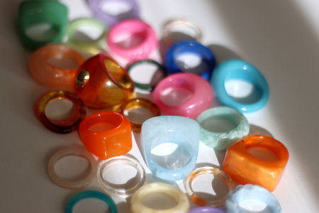Collection of colorful plastic rings on white background. Selective focus.の写真素材