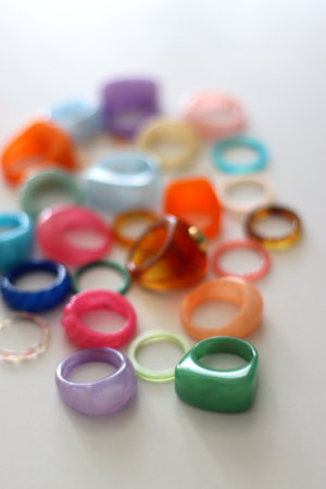 Collection of colorful plastic rings on white background. Selective focus.の写真素材