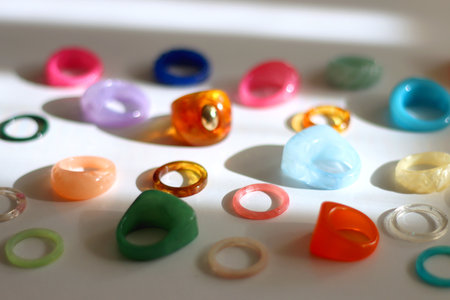 Collection of colorful plastic rings on white background. Selective focus.の写真素材