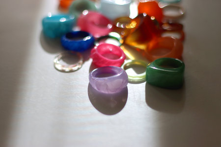 Collection of colorful plastic rings on white background. Selective focus.の写真素材