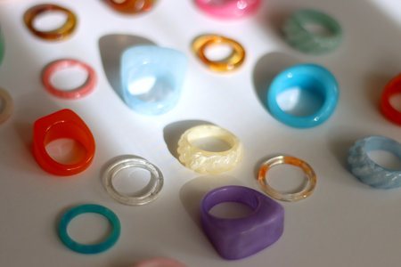 Collection of colorful plastic rings on white background. Selective focus.の写真素材