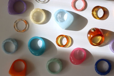Collection of colorful plastic rings on white background. Top view.の写真素材