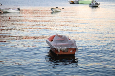 Small fishing boats in Stobrec, Croatia. View of Podstrana in the background. Stobrec and Podstrana...
