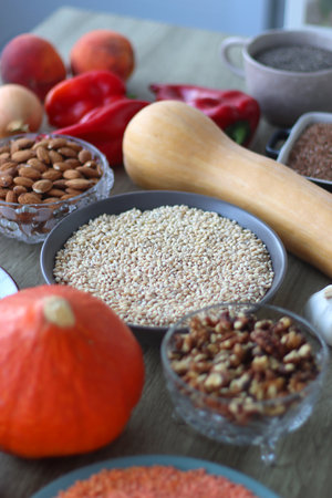 Assortment of various healthy fruits, vegetables, grains and legumes. Selective focus, wooden background.の写真素材