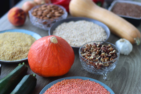 Assortment of various healthy fruits, vegetables, grains and legumes. Selective focus, wooden background.の写真素材