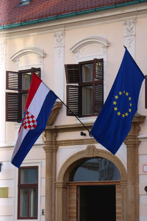 Croatian flag and flag of European Union on a historic Parliament building in uptown Zagreb, Croatia.の写真素材