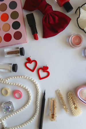 Various accessories and beauty products on white background. Coquette aesthetic. Flat lay.の写真素材