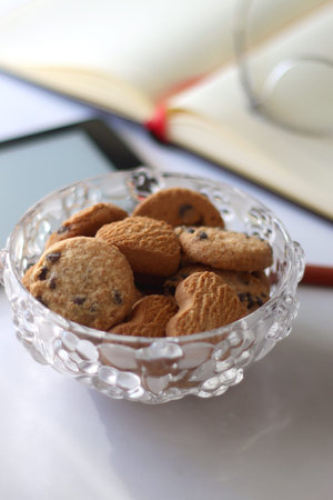 Cookies in bowl on white background. Selective focus.の写真素材