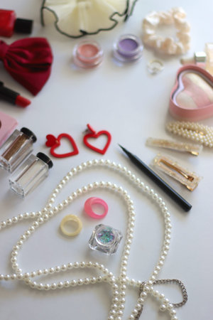 Various accessories and beauty products on white background. Coquette aesthetic. Selective focus.の写真素材