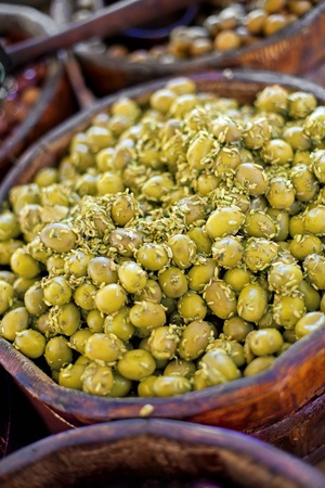 Green olives displayed on concession standの写真素材