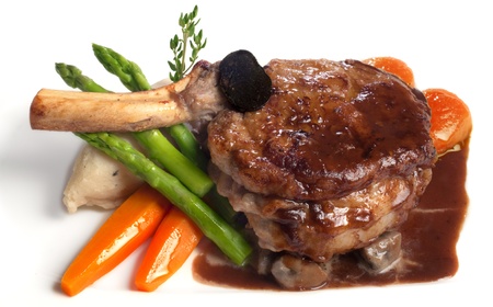 Veal chop served with vegetablesの写真素材
