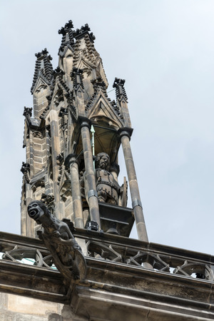The Cathedral of Saint Vitus (1344) in Prague, Czech Republic, side view architectural detail, with scary gargoyles protecting the towersの写真素材
