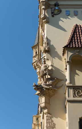 Architectural detail of a warrior killing a dragon on a building at the Old Town Square, Prague, Czech Republicの写真素材