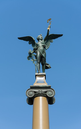 Angel holding a branch at the Czech Bridge entrance column, Prague, Czech Republicのeditorial素材