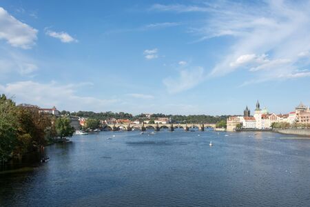 Panoramic view of Vltava river and Charles bridge on a bright summer day, in Prague, Czech Republic