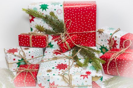 Gift boxes and fir tree isolated on white background. Christmas and New Year holidays backgroundの写真素材