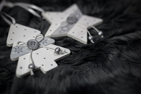 Wooden ornaments on dark cozy background. Christmas and New Year holidays concept.の写真素材