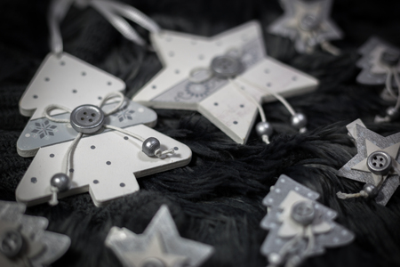 Wooden ornaments on dark cozy background. Christmas and New Year holidays concept.の写真素材