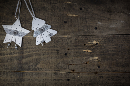 Wooden ornaments on the old wooden floor, empty space for text. Christmas and New Year holidays concept.の写真素材