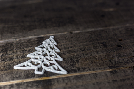 Christmas tree ornament on the old wooden floor. Winter holidays background with empty space for text.の写真素材