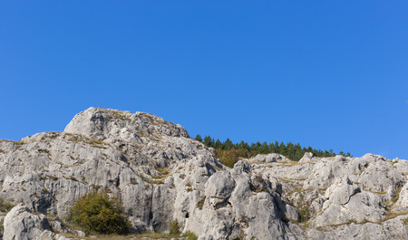 Panoramic view of rocky hill and a blue skyの写真素材