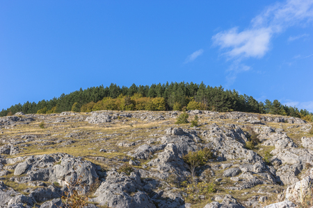 Colorful landscape of the rocky hill at the end of summerの写真素材