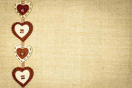 Red and white hearts on vintage background. Valentine's day greeting card with place for text.の写真素材