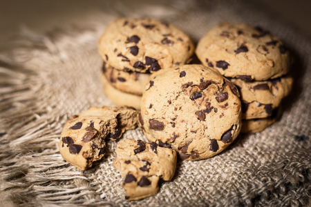 Fresh Chocolate chip cookies, freshly baked on rustic background. Close-up view with selective...