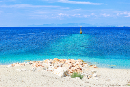 Crystal clear azure water on beautiful sandy beach on Ionian island Lefkada in Greeceの写真素材
