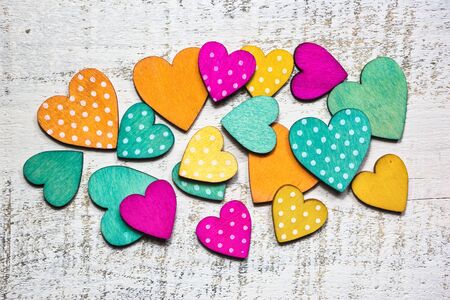 Colorful hearts on white woodenの写真素材