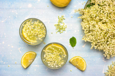 Top view of homemade elderflower lemonade with fresh ingredients for healthy and refreshing drink.の写真素材