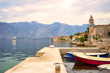 Picturesque Mediterranean village with stone houses against gray mountains, Montenegro, Bay of Kotor ( Adriatic Sea ), Stoliv village. Travel concept, background.のeditorial素材