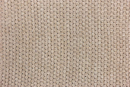 Beige knitting texture background, warm blanket. Good pattern for design.