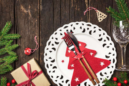 Christmas table place setting with Christmas decorations and gifts, top view with copy space. Winter Holidays background.の写真素材