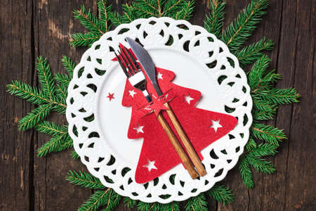 Christmas table place setting with Christmas decorations, top view with copy space. Winter Holidays background.の写真素材