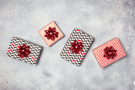 Gift boxes with red decorations on grayの写真素材