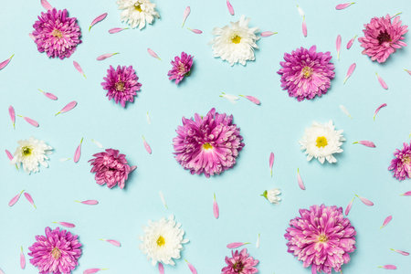 Flowers composition. Pattern made of colorful flowers on pastel blue background. Spring, easter,...
