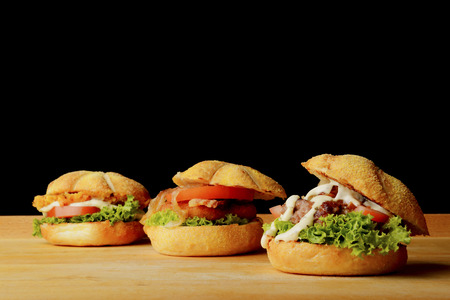 Appetizing veggie, fish and beef burgersの写真素材