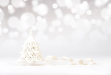 Decorative christmas tree with silk ribbon on  blurry backgroundの写真素材