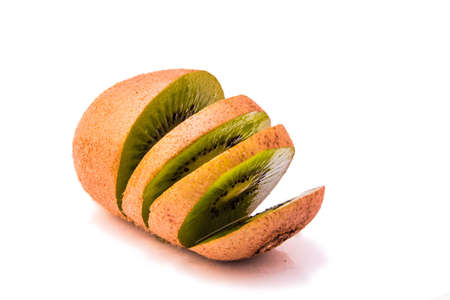 isolated kiwi sliced up on white の写真素材