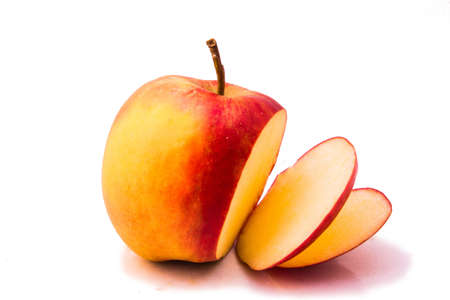 isolated apple sliced up on white の写真素材