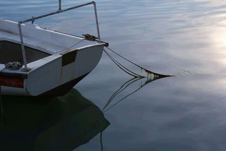 Old Boats reflection on sea surafceの写真素材